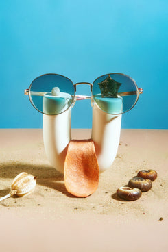 a pair of glasses sitting on top of a table