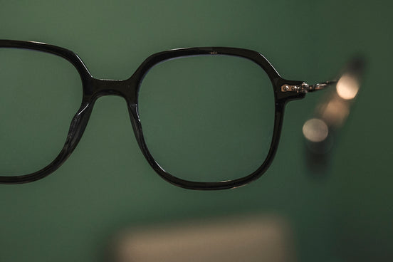a pair of glasses hanging on a wall