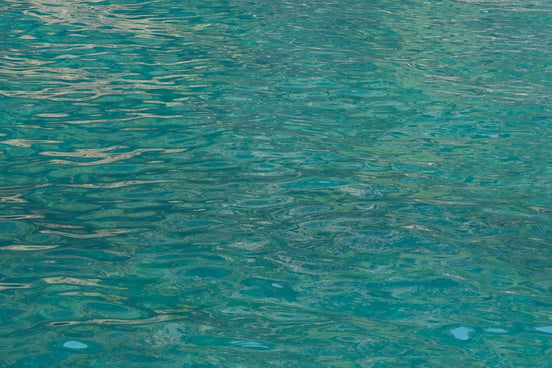 A boat floating on top of a body of water