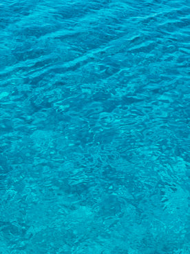 A boat floating on top of a body of water