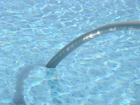 Pool water with a grab bar is visible.